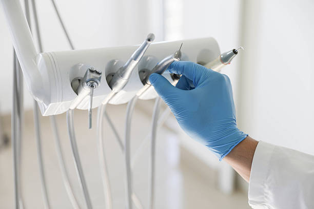 Professional Root Canal Treatment technician working in Woodmere, NY